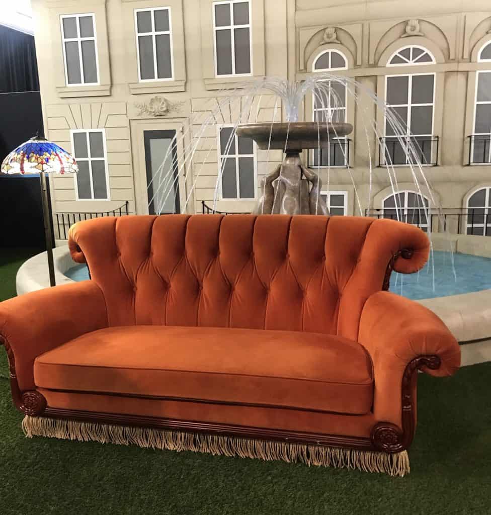 orange couch from the FRIENDS Experience 