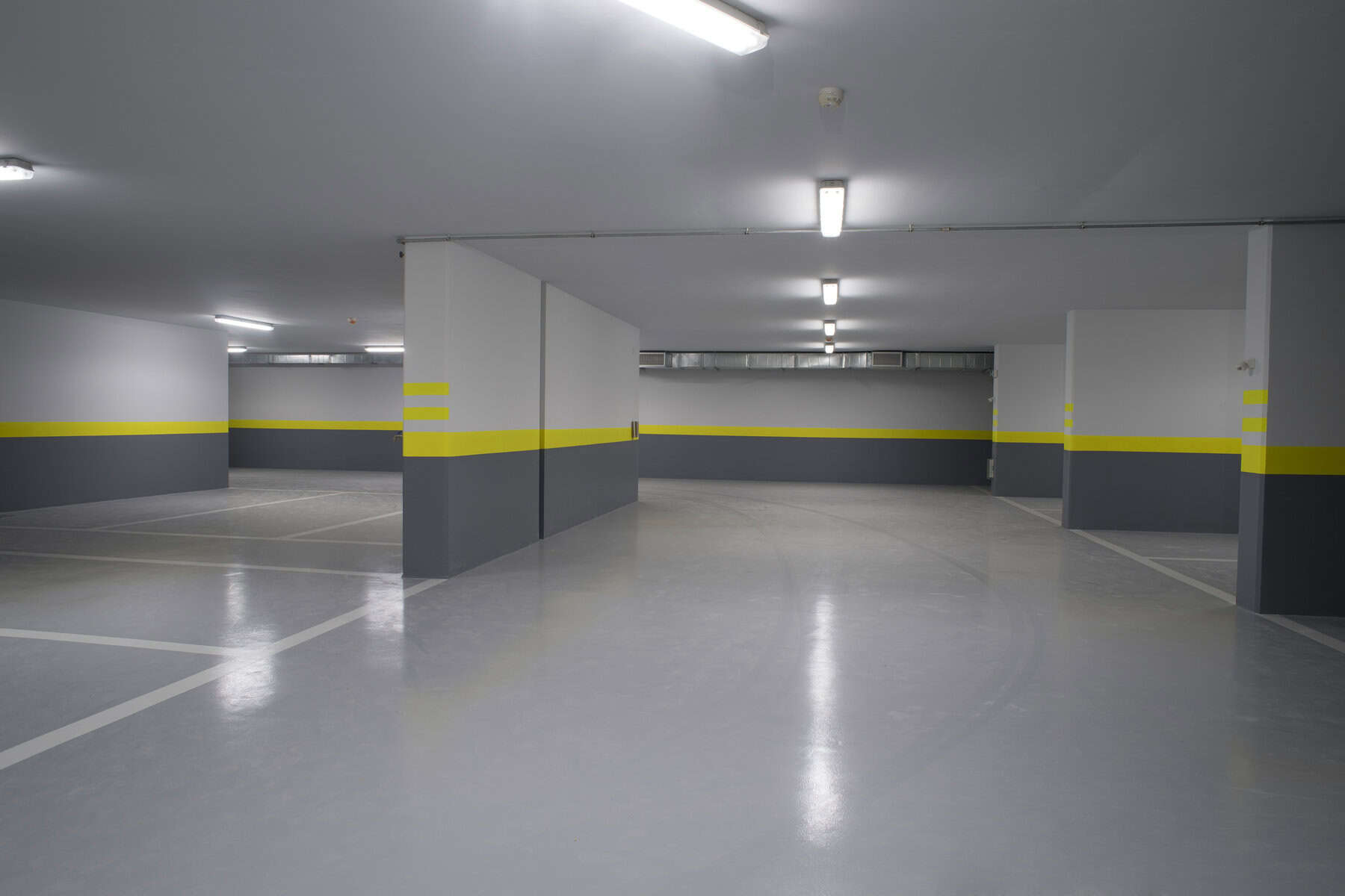 Empty parking garage underground interior in apartment or in supermarket